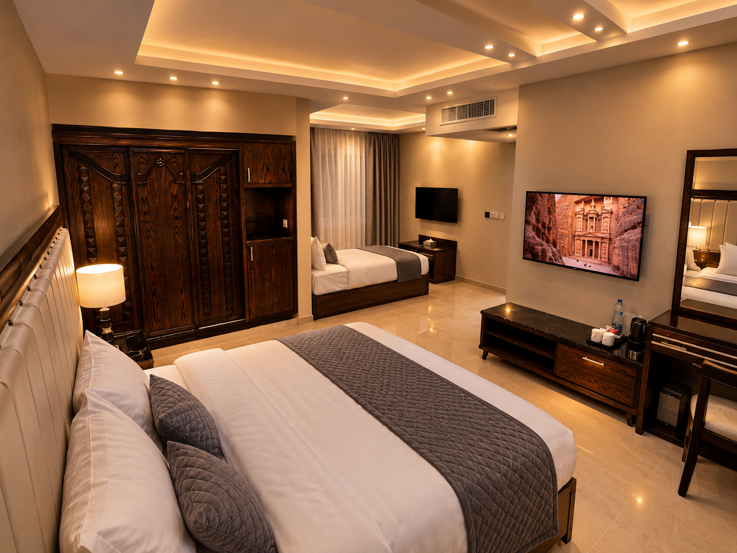 Family room with king bed and twin beds and private terrace