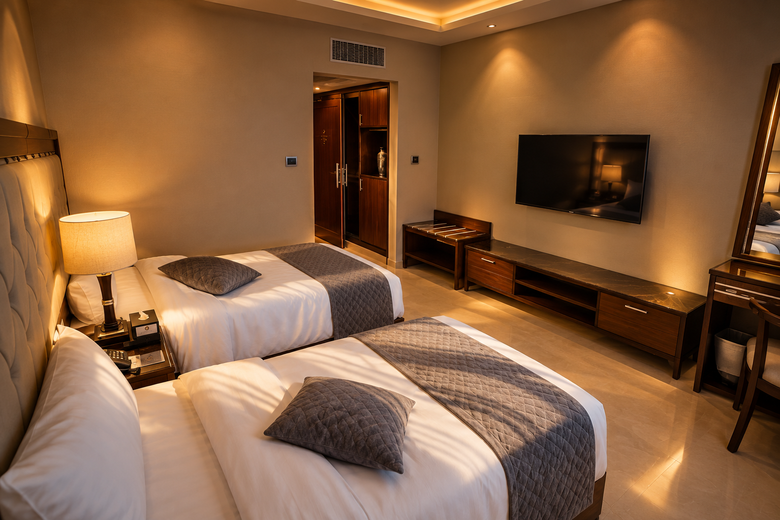 Standard twin room with two beds and heritage stone walls